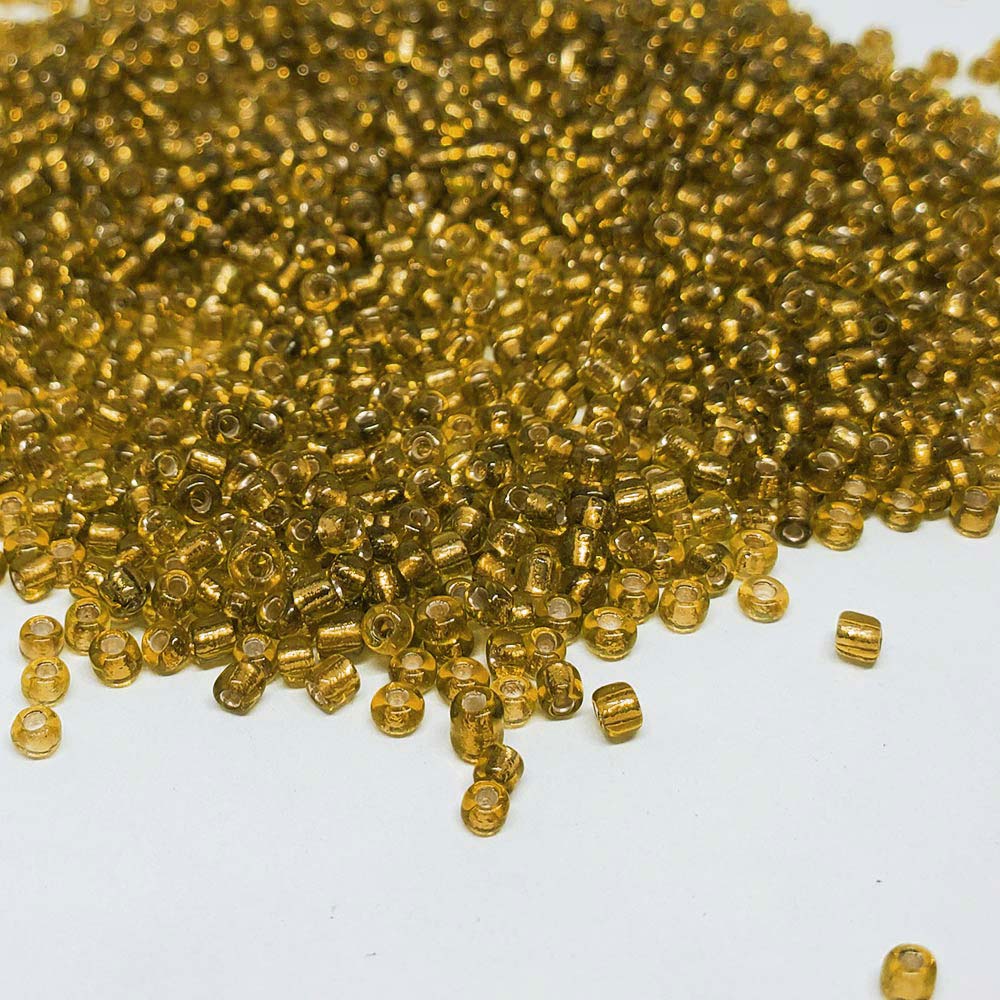 Mostacilla Dorado Claro Transp. Fondo Plata 12/0