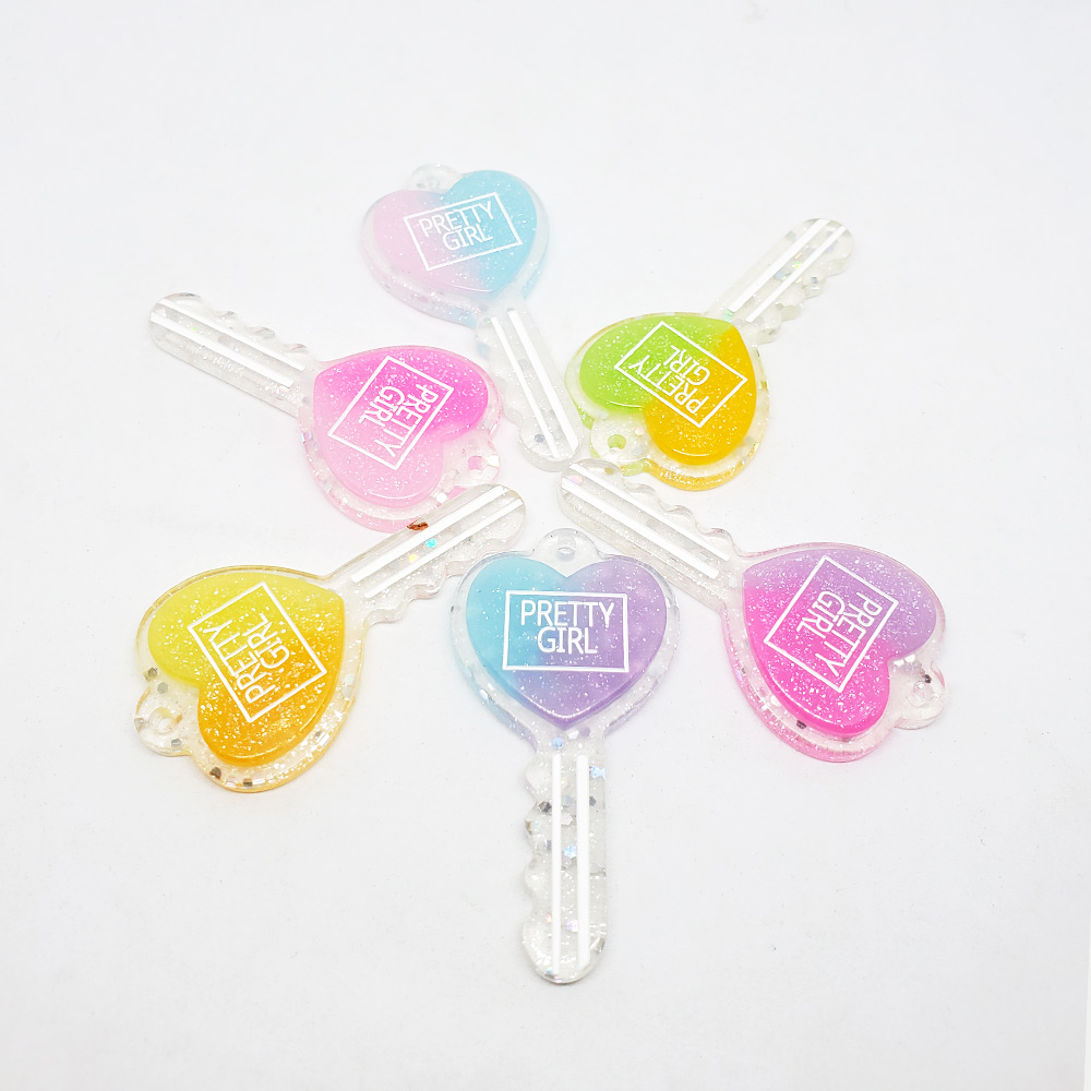DIJE CORAZON LLAVE-RESINA MULTICOLOR 58*29MM