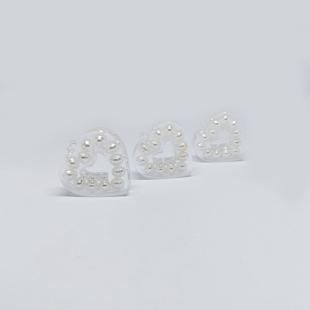 ACRILICO CORAZON TRANSPARENTE CON PERLAS 31*29MM 1 ARGOLLA