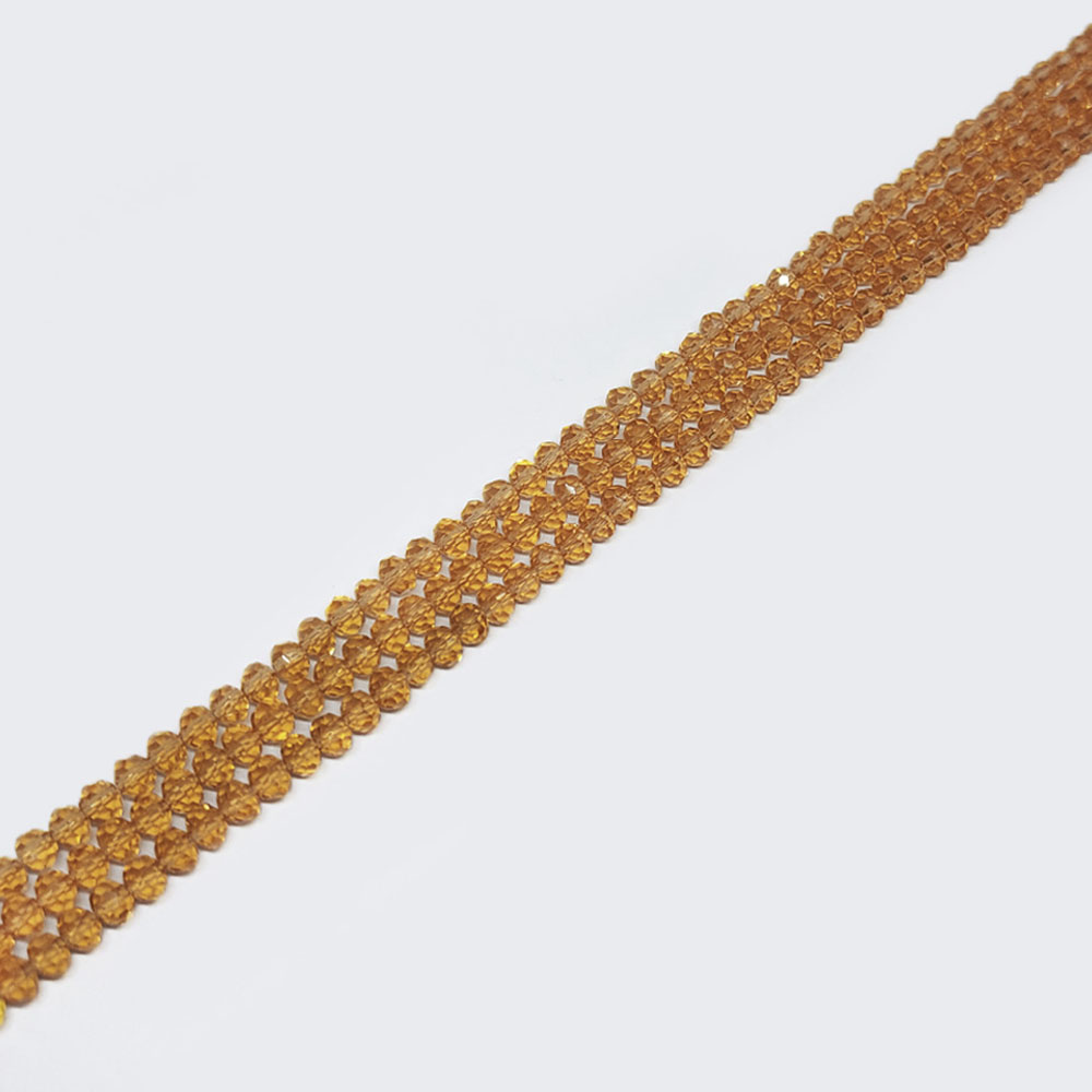 CRISTAL DONA DORADO TRANSPARENTE 7*8 MM